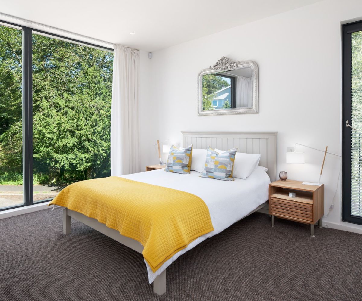 A contemporary bedroom with a double bed