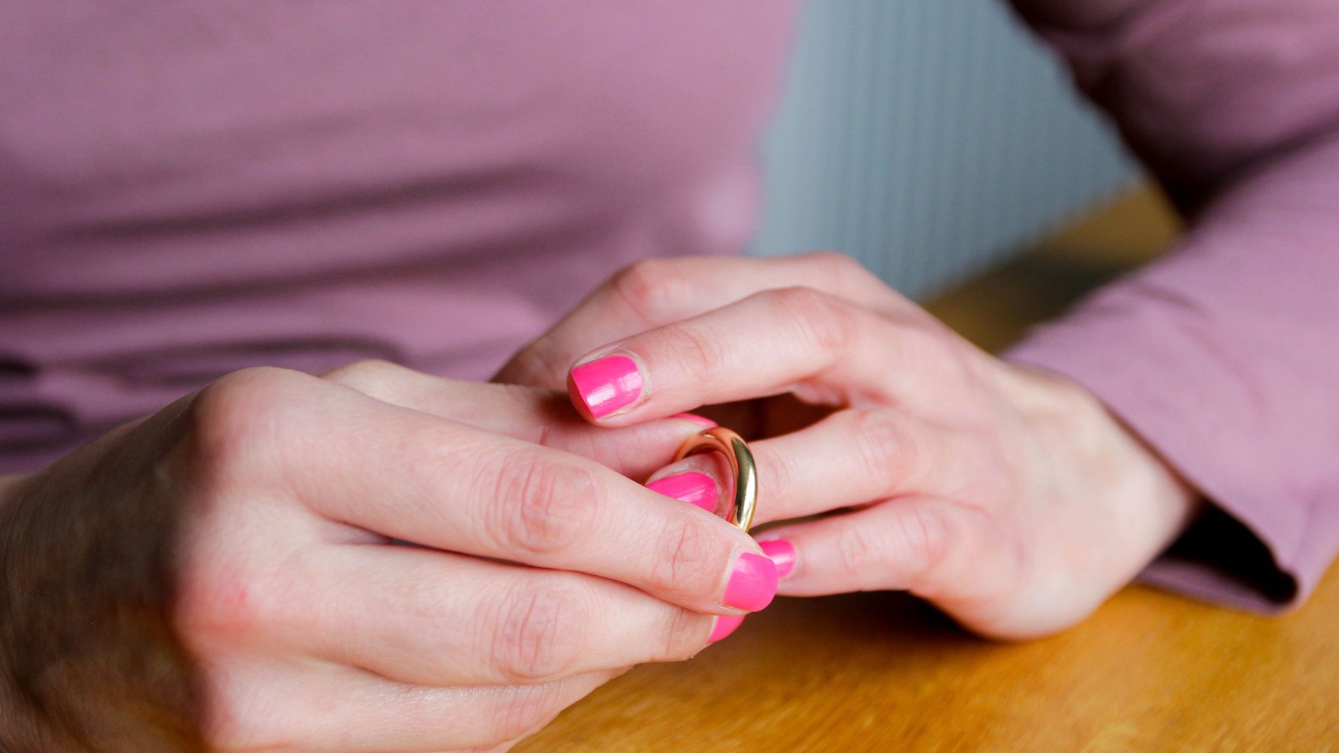 Woman removing her wedding ring