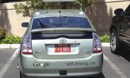 Google's self-driving car is "designed to avoid distracted driving," says Nevada's DMV director. "When you're on the [Las Vegas] Strip and there's a huge truck with a three scantily clad wome