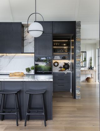 black kitchen with lighting