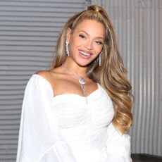 Beyoncé in a white outfit at the launch of her hair care line, CÉCRED