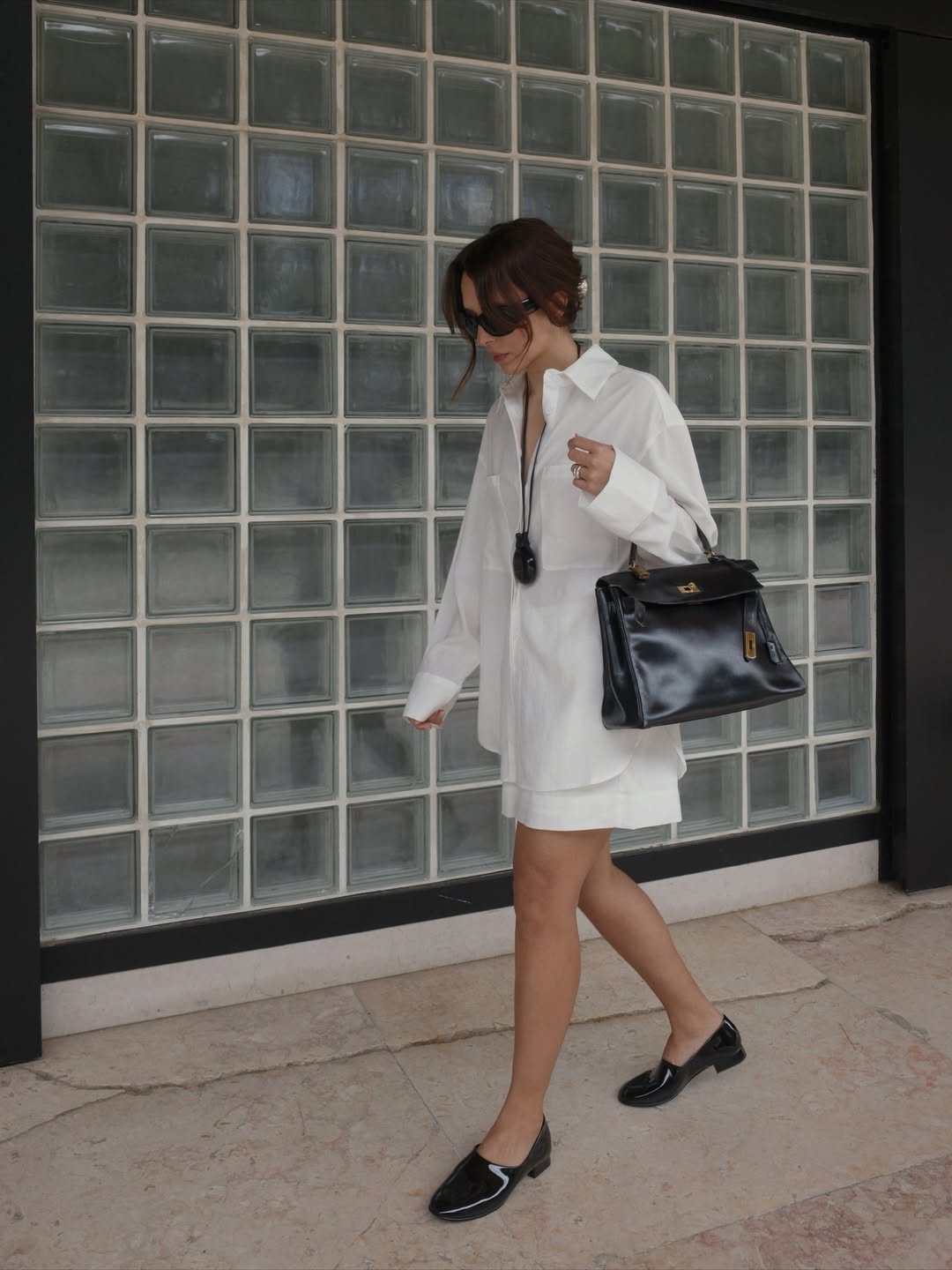 Debora in white linen set and black loafers