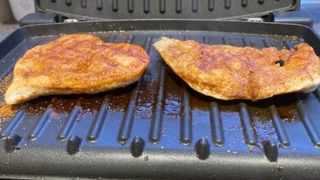 A George Foreman cooking Chicken