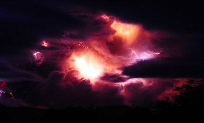 Lightning illuminates a massive cloud of ash that billows out of Chile&amp;#039;s Puyehue volcano, which erupted Sunday for the first time in half a century.