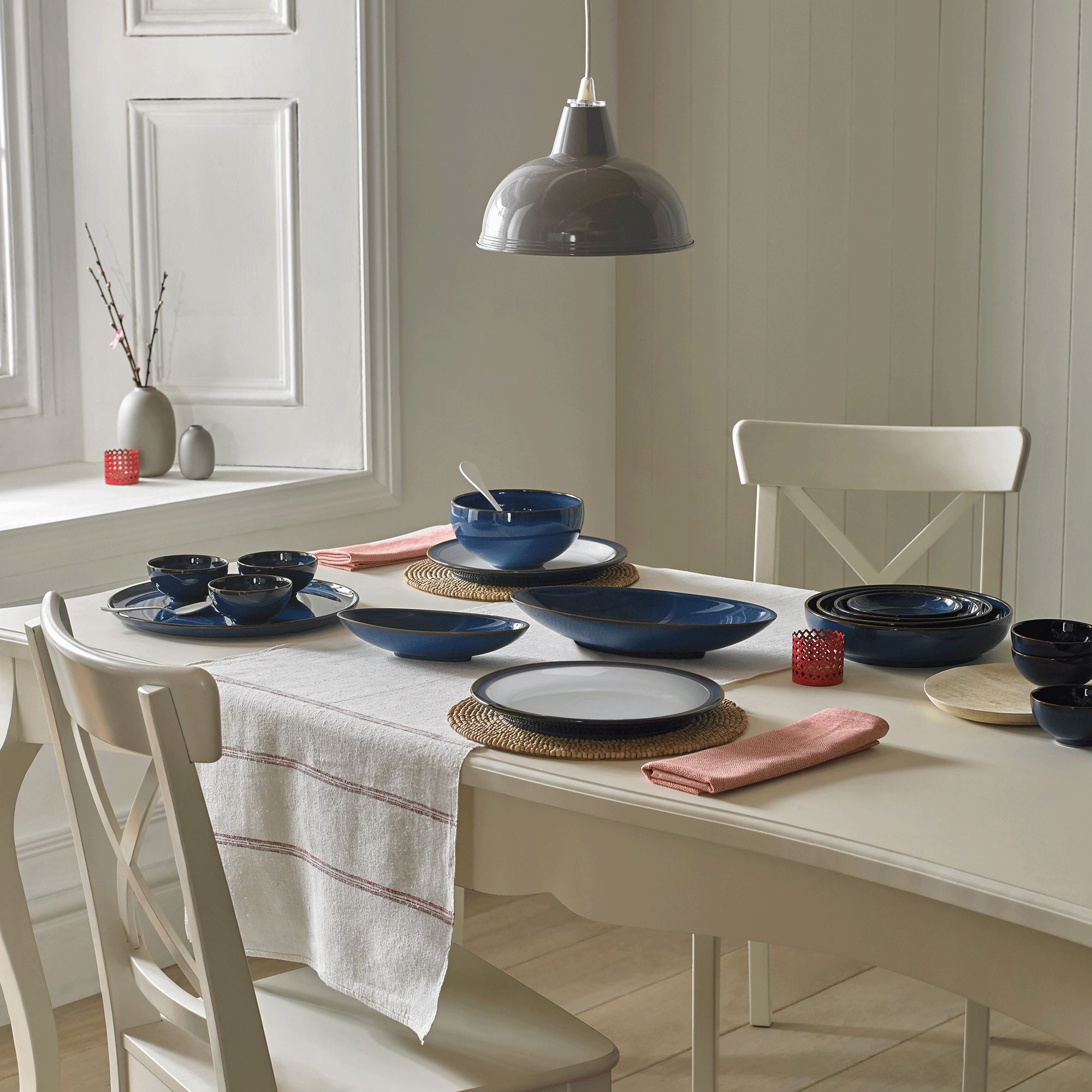 Imperial blue Denby dinner set on white table