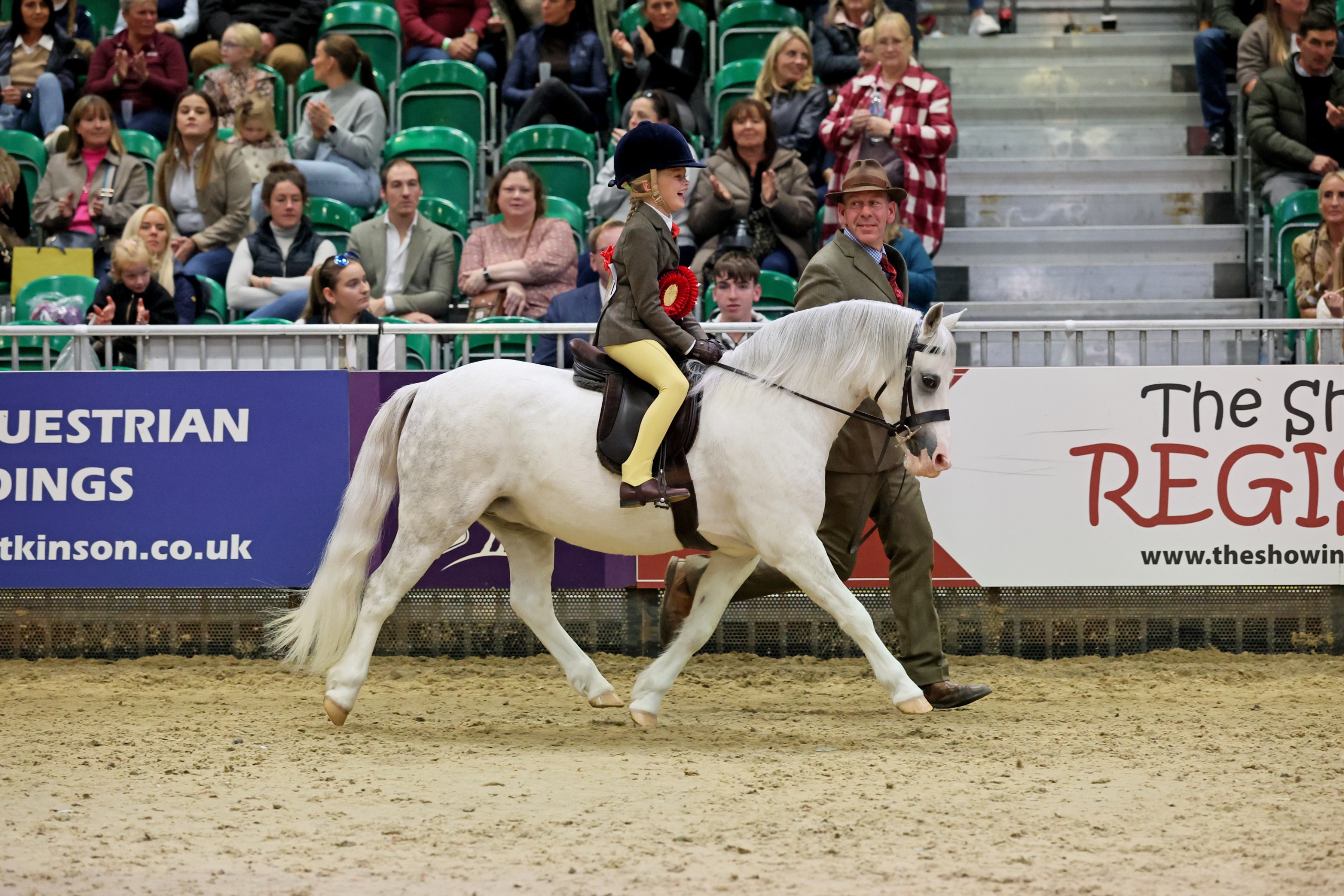 Thistledown Wood Owl and Gracie-May Whitaker led by Craig Elenor in their lap of honour at HOYS 2026
