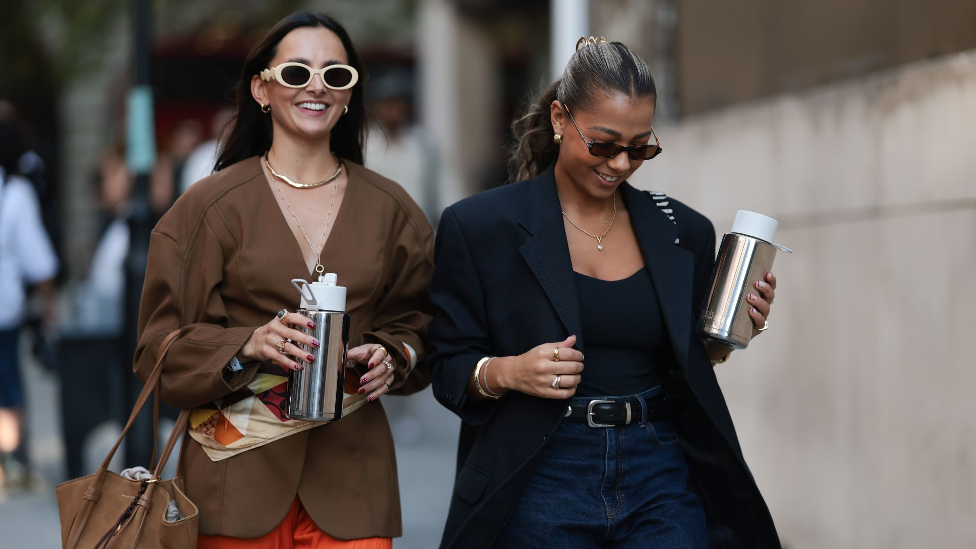 perfume for a job interview An image showing two women attending London Fashion Week 2025