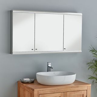 Mirror bathroom cabinet above sink on wooden storage unit
