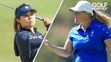 Danielle Kang watches a wedge shot, Caroline Hedwall punches the air