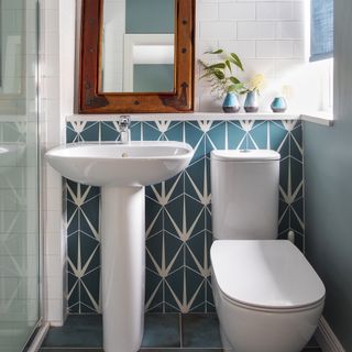 bathroom with white sink and lilypad porcelian tiles