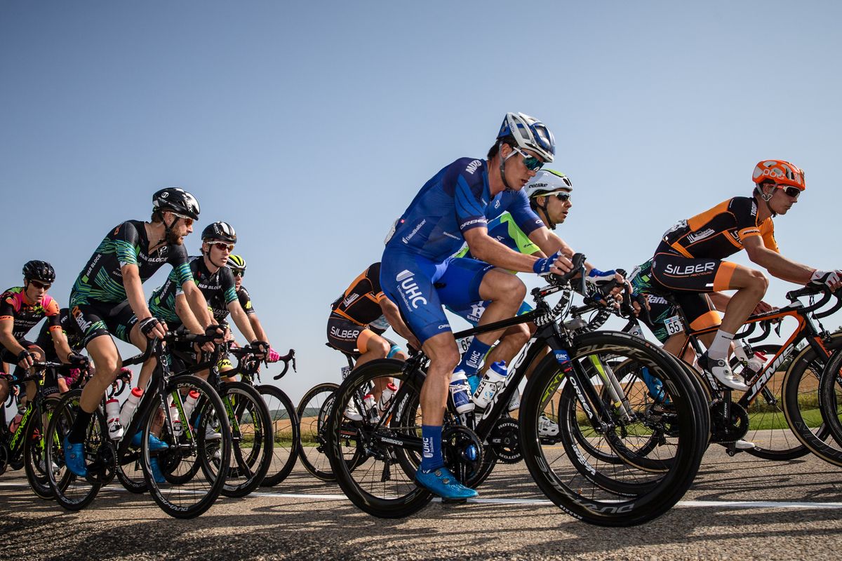 Travis McCabe rides in the bunch during stage 2 at the Tour of Alberta