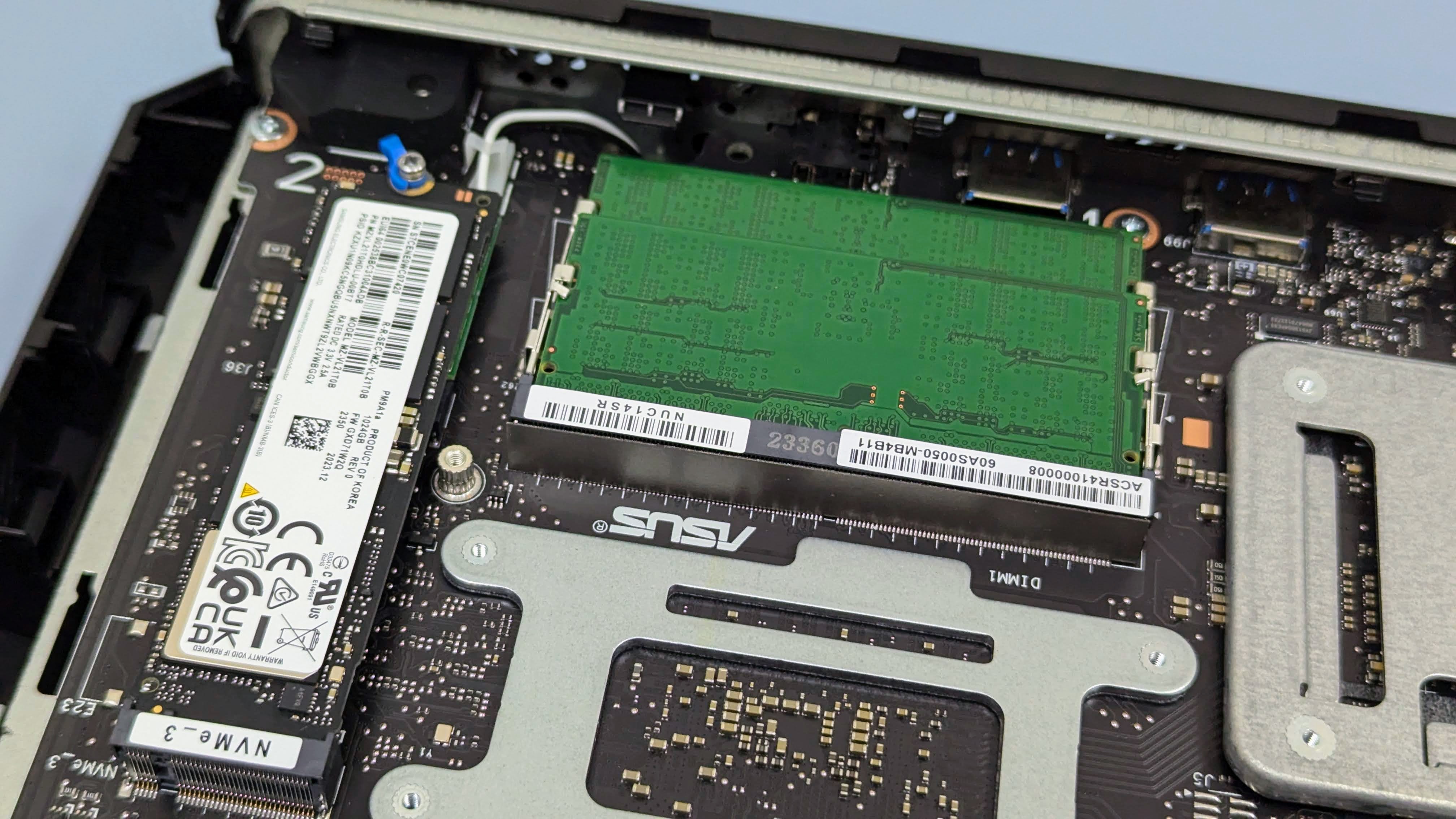 Close up inside the Asus ROG NUC 970 with cover off, showing the RAM and SSD.