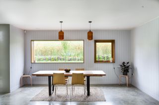 timber clading dining room with large picture windows