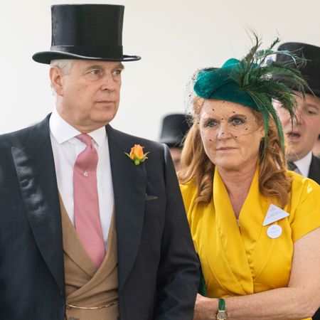 Prince Andrew wears a top hat and tails while his ex-wife Sarah Ferguson wears a bright yellow dress with a green feathered hat
