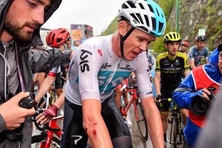 Chris Froome got banged up in the wet final climb