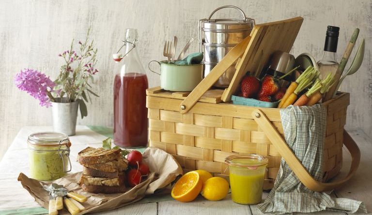 Picnic Basket with Food and Flowers