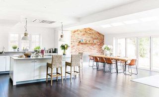 industrial style kitchen diner with exposed brick wall