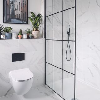 Black and white bathroom with modern shower glass panel