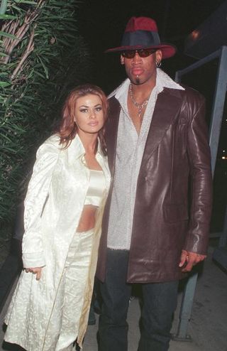 new laker dennis rodman celebrates his first winning game out on the town at goodbar with wife carmen electra