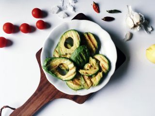Grilled avocado showing what can be cooked on a BBQ other than meat.