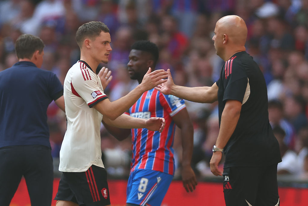 Liverpool Manager Arne Slot reacts to Florian Wirtz during the 2025 FA Community Shield match between Crystal Palace and Liverpool at Wembley Stadium on August 10, 2025 in London, England