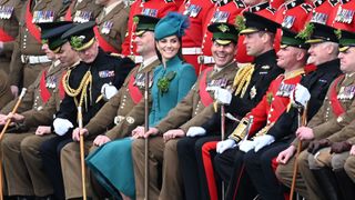 Prince William, Prince of Wales, Catherine, Princess of Wales and members of the 1st Battalion Irish Guards pose for photographers