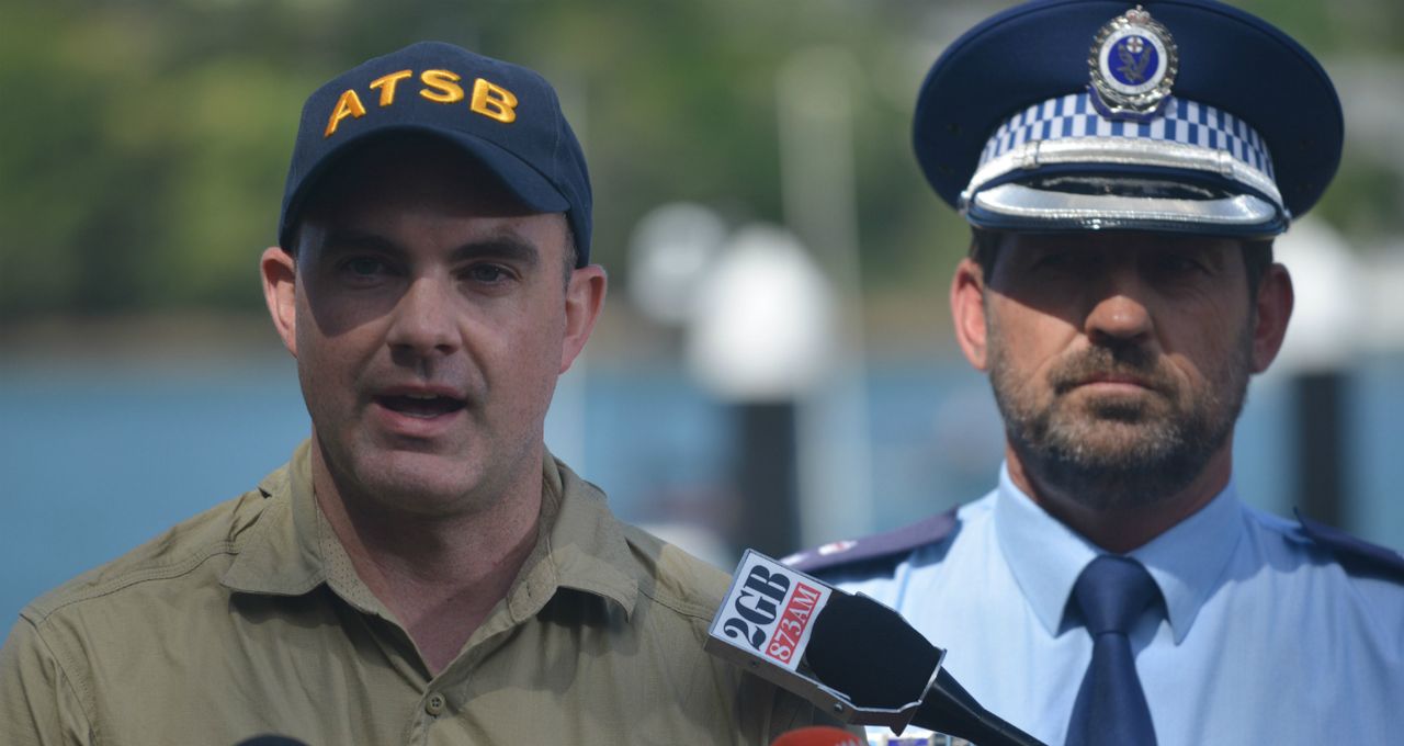 ATSB officer Nat Nagy (L) discusses Sydney seaplane accident 