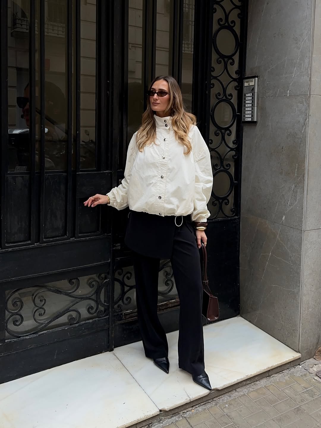 woman wearing winter to spring transitional jacket trends 2026