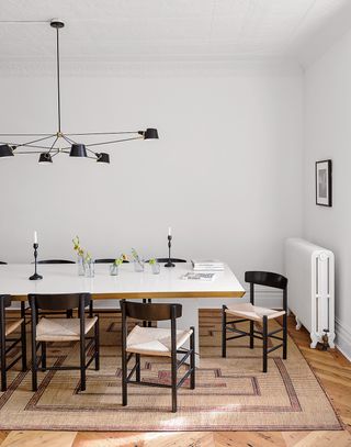 white dining room with black chairs