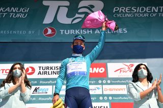 ALANYA TURKEY APRIL 13 Podium Mark Cavendish of United Kingdom and Team Deceuninck QuickStep Turquoise Leader Jersey Celebration during the 56th Presidential Cycling Tour of Turkey 2021 Stage 3 a 2126km stage from Beyehir to Alanya Mask Banana Trophy Covid Safety Measures TUR2021 tourofturkeyTUR on April 13 2021 in Alanya Turkey Photo by Stuart FranklinGetty Images