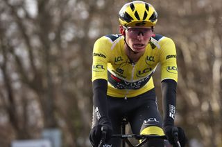 Team Visma-Lease a Bike's US rider Matteo Jorgenson wearing the overall leader's yellow jersey reacts after crossing the finish line of the 4th stage of the Paris-Nice cycling race, 163,4 km between Vichy and La Loge des Gardes, on March 12, 2025. (Photo by Anne-Christine POUJOULAT / AFP)