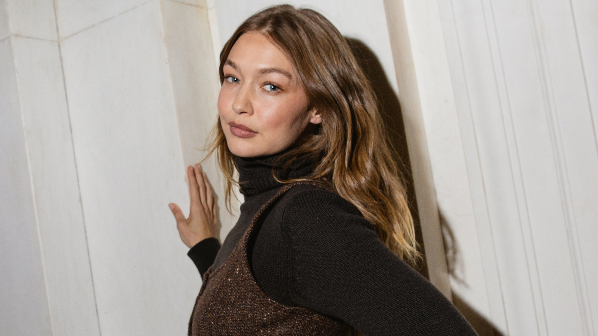 Gigi Hadid wore jeans, cowboy boots, a tank top, and Western hat inspired by her sister, Bella Hadid.