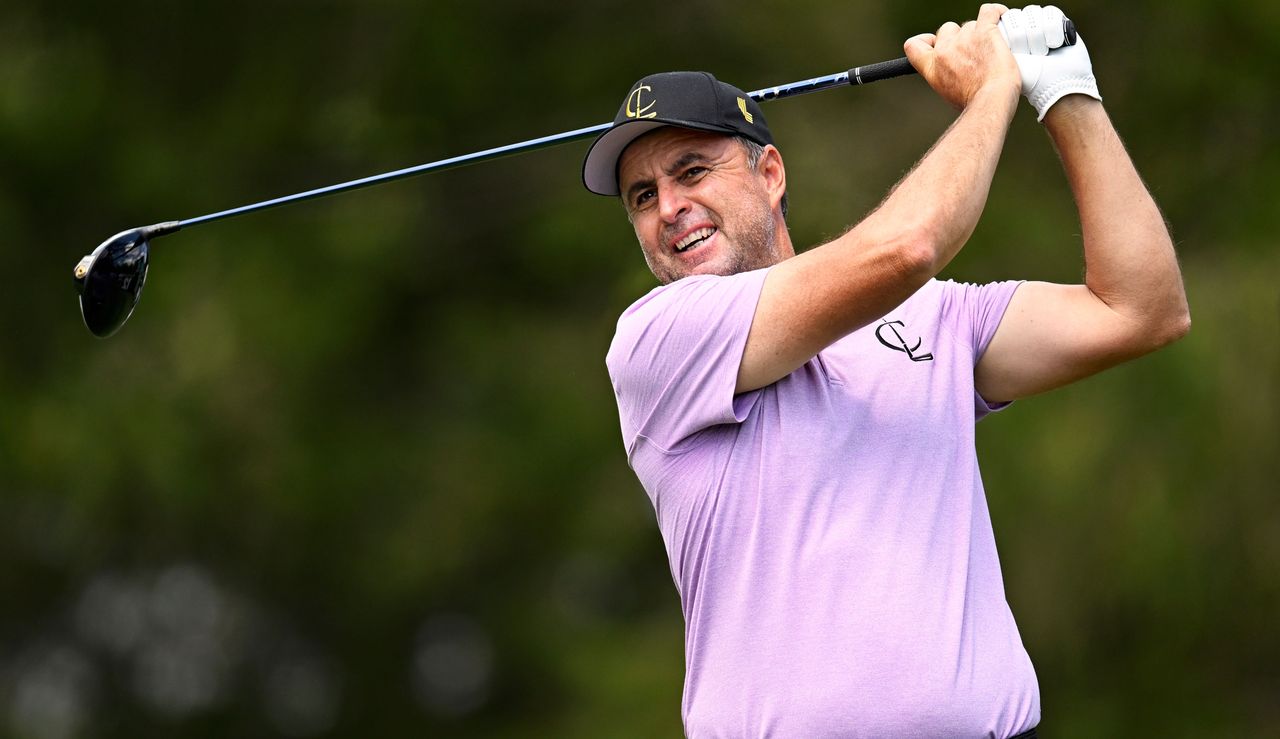 Richard Bland strikes his tee shot with a driver and watches the flight of it