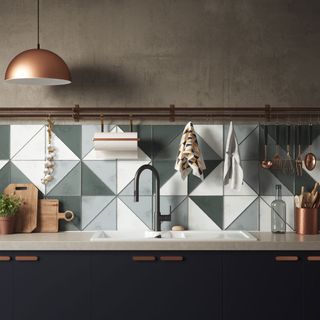 kitchen area with triangle tiles and washbasin