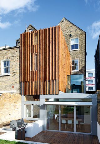 Double storey extension ideas: Sculptural timber extension by Paul Archer Design