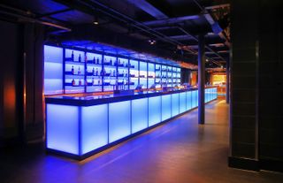 blue-lit bar inside the Outernet