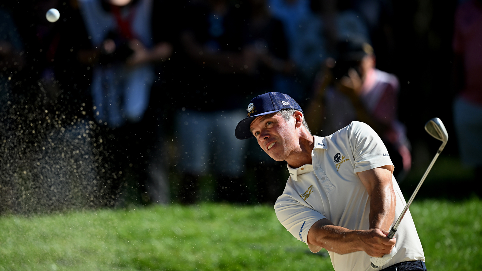 Paul Casey hits a bunker shot