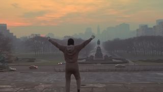 Rocky stands atop the steps in Philadelphia in Rocky