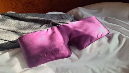 Drowsy eye mask on a white sheet