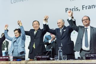 UNFCCC head Christiana Figueres, U.N. Secretary-General Ban Ki-moon, French Minister of Foreign Affairs Laurent Fabius and French President François Hollande celebrate the passage of the Paris climate agreement.