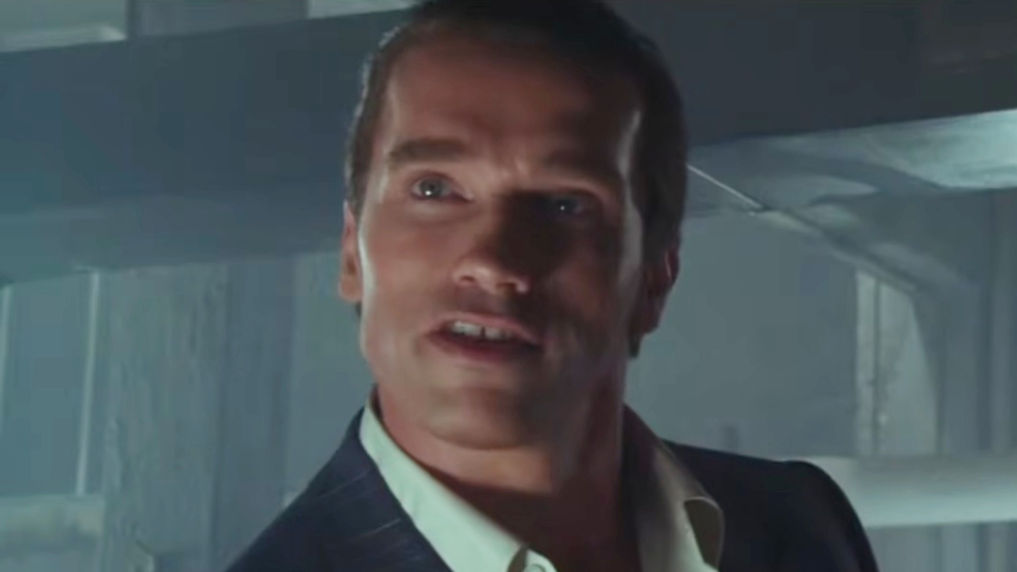 Arnold Schwarzenegger with his hair slicked back in Raw Deal