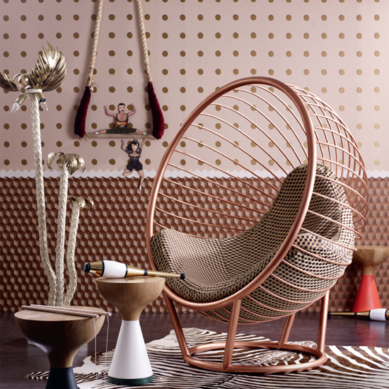 room with bubble chair and dotted printed pattern on wall