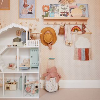 pink girls bedroom with toy storage