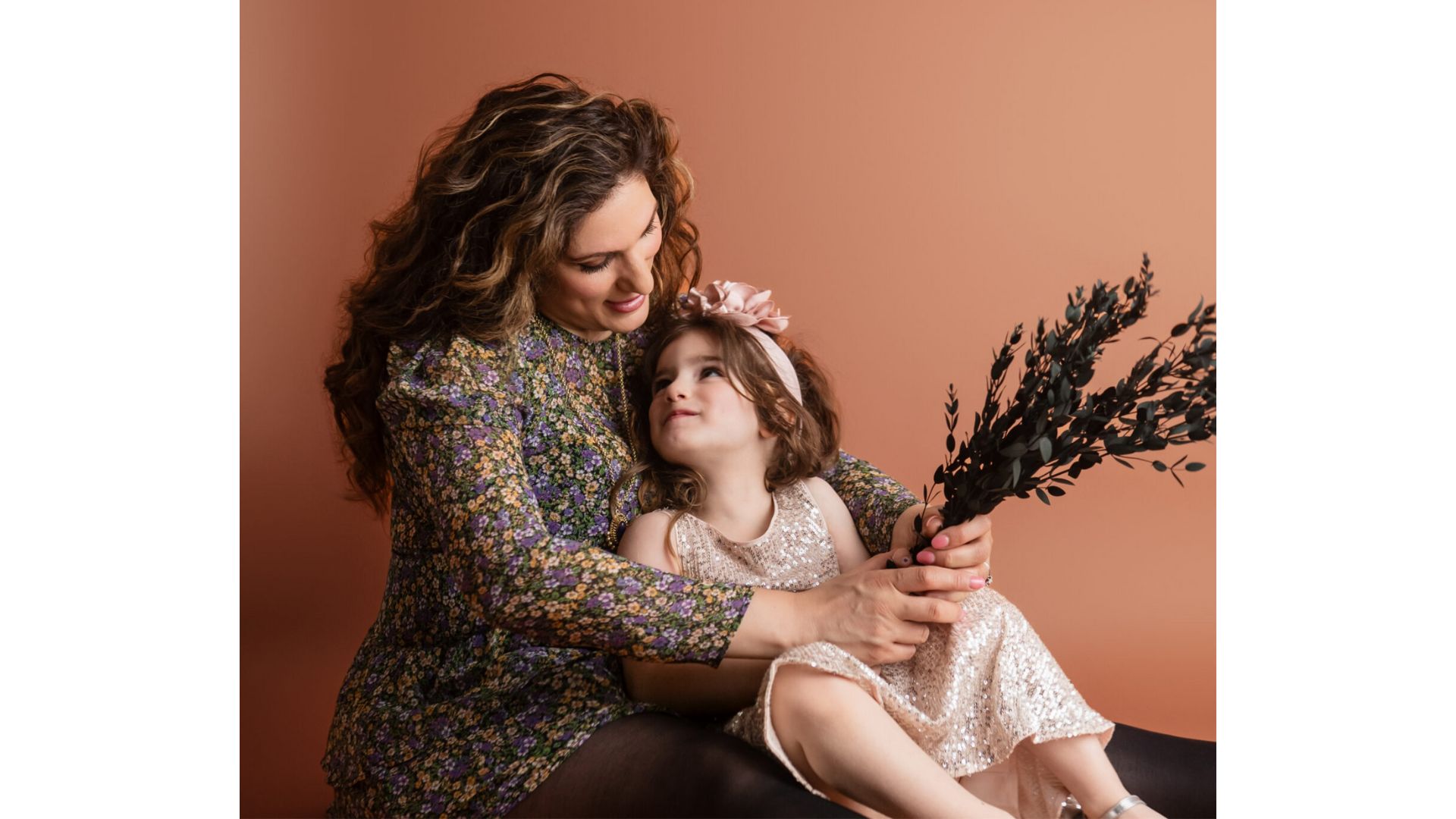Vicki Broadbent of @honestmum with her daughter Florence, wearing nice dresses and gazing at each other