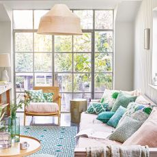 living room with floor to ceiling industrial windows