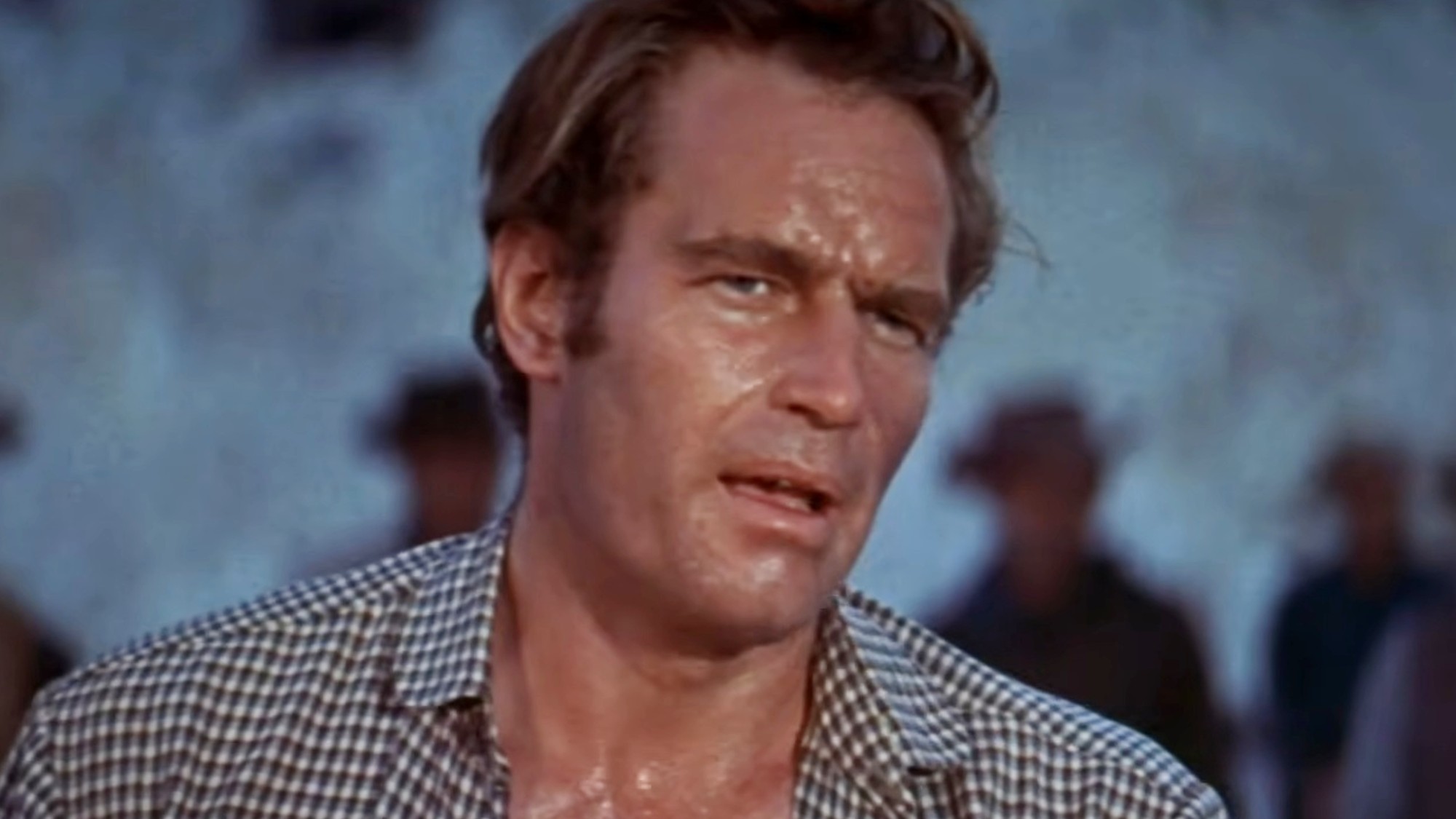 An exhausted and sweaty Charlton Heston in The Big Country