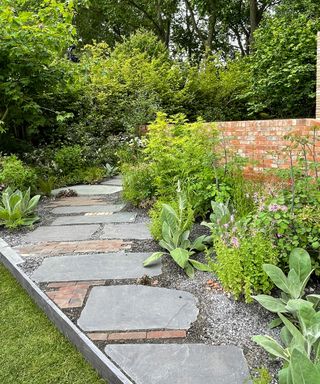 patchwork style garden path with different styles of paving mixed together