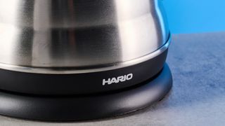 hario v60 buono gooseneck kettle, a stainless steel kettle with electric base, handle, and gooseneck spout, for specialty coffee