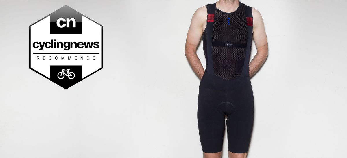 Reviewer wearing the Castelli Premio Black bib shorts, stood in front of a grey background, with &#039;recommends&#039; badge overlaid