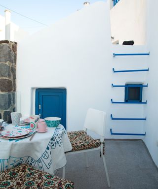 Patio painted white and blue in a Greek home
